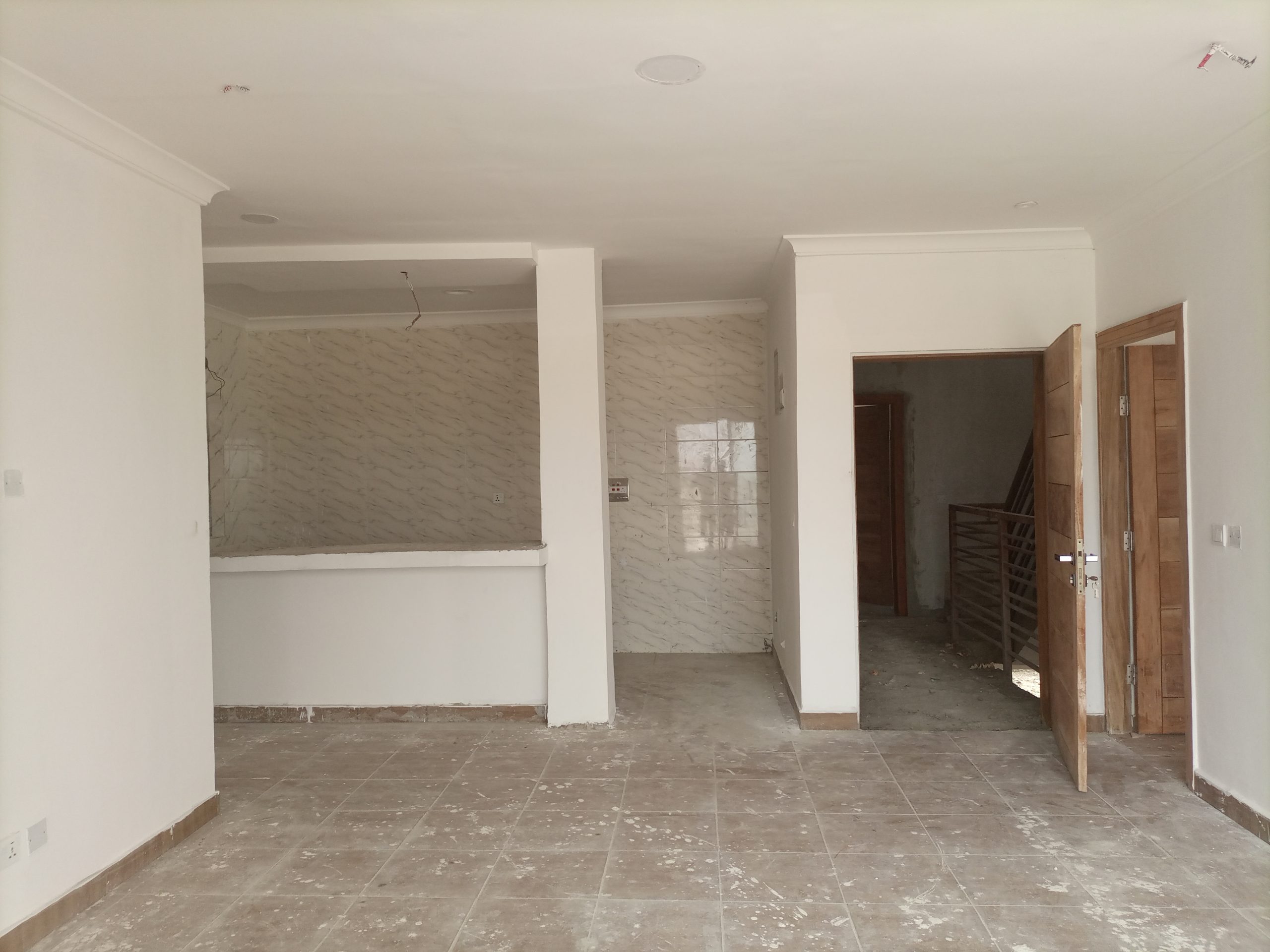 Spacious Living area with open plan kitchen of 2 Bedroom Serviced Apartment for sale in Abijo with installment payment