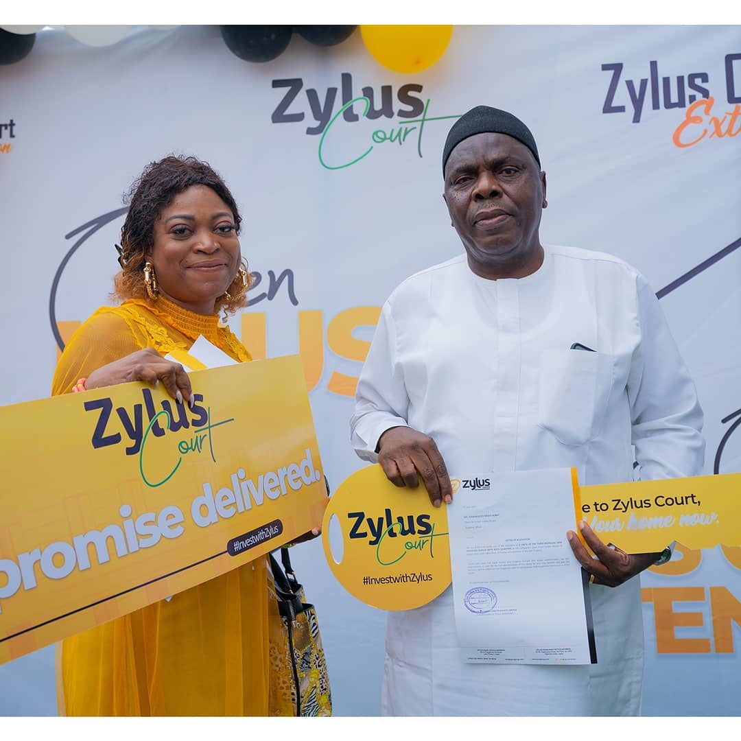 Happy and proud client collecting hand over keys at Zylus Court, Bogije, Ajah